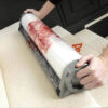 Packexe Carpet Protector film being applied to stairs